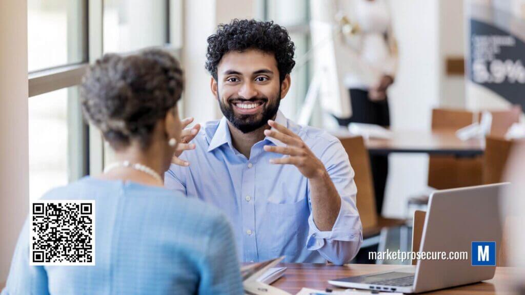 Two people engaging in a conversation about Raisin benefits while seated at a table.