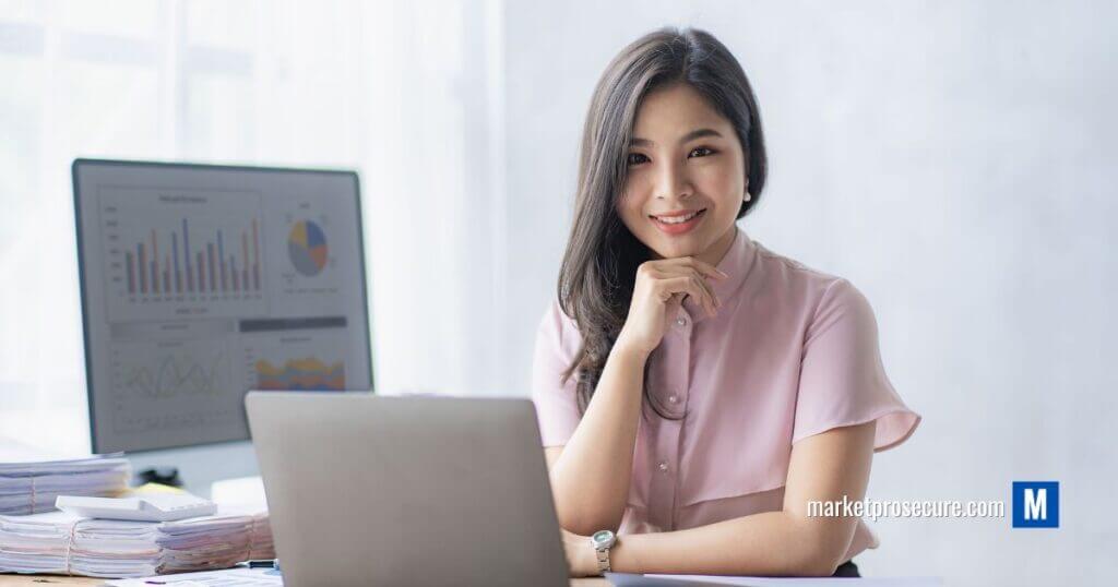 Meet the savvy woman who has mastered the art of personal finance management! Picture this: she’s at her desk, laptop open, a confident smile on her face as she leans in with curiosity and focus. Behind her, a monitor illuminates with dynamic graphs and charts—the heartbeat of financial success. To her side, an organized stack of documents signifies well-planned strategies honed to precision. It’s more than just an office space; it’s ground zero for conquering financial goals and building wealth. Learn from this scene as we dive deep into tips that turn your personal finance dreams into reality!.